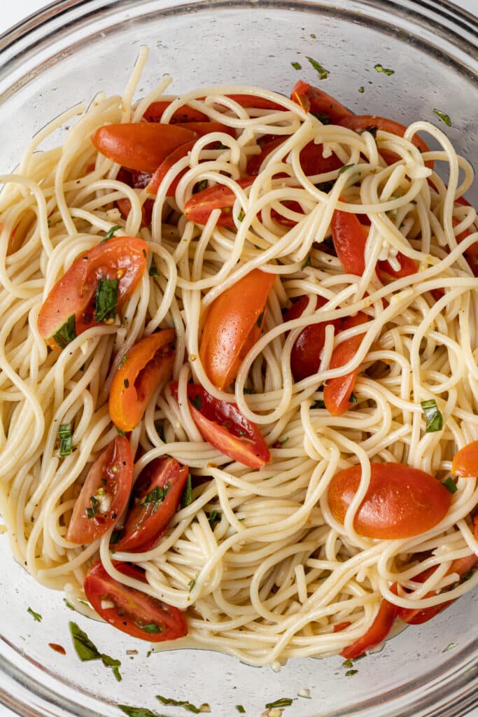 pasta ingredients combined in glass mixing bowl 