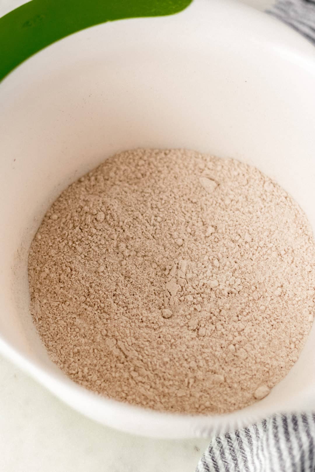 Large white bowl with dry ingredients for pumpkin scones. 