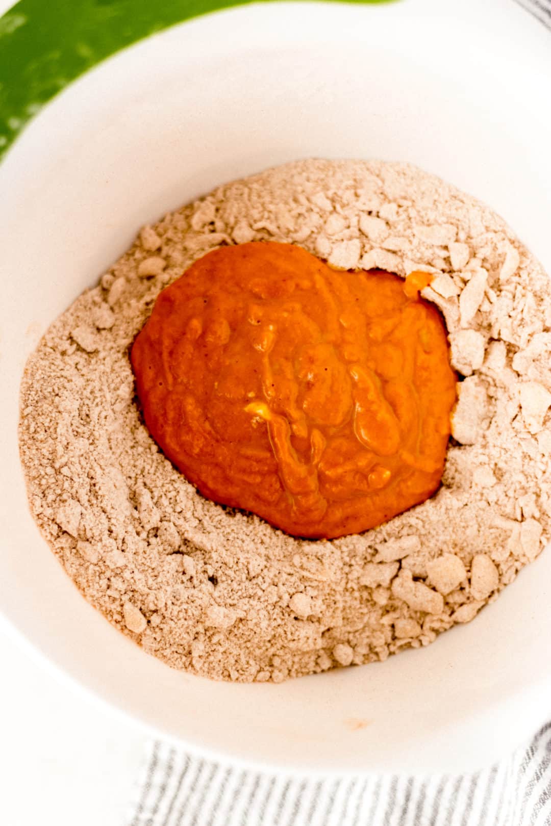 mixuture of ingredients for pumpkin scones in a mixing bowl