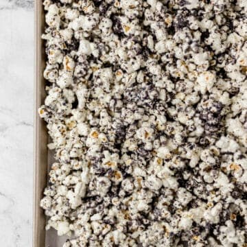 overhead view of finished popcorn on parchment lined baking sheet