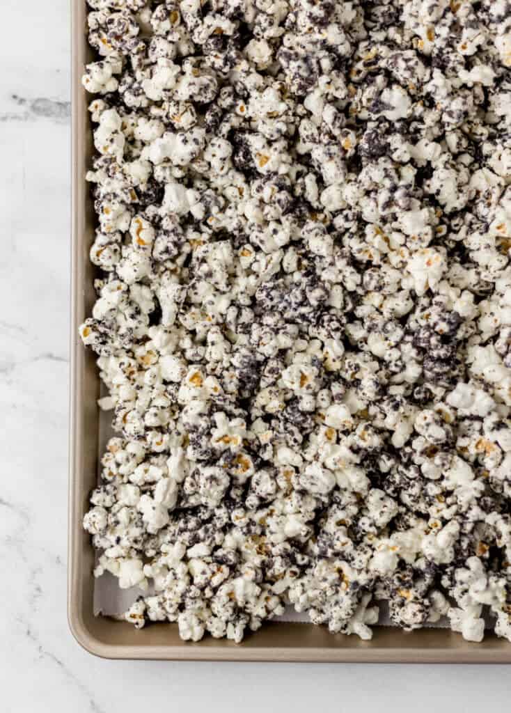 overhead view of finished popcorn on parchment lined baking sheet