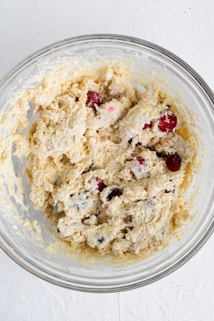 cranberry scone dough in glass mixing bowl 