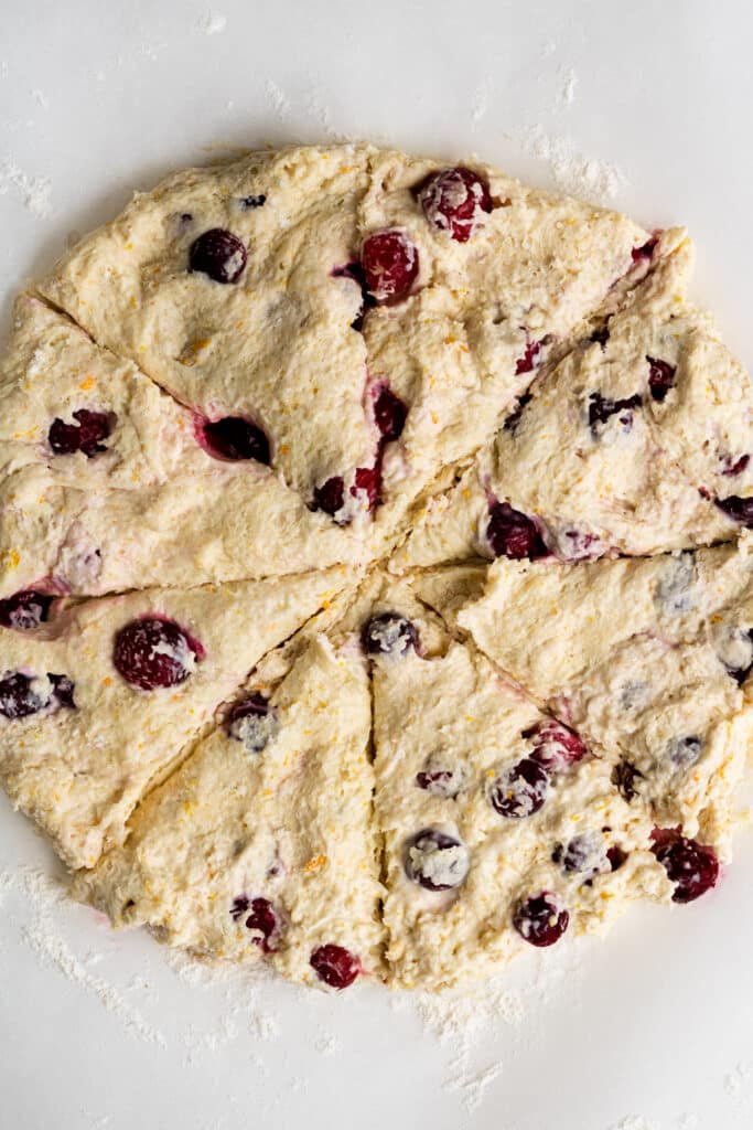 scone dough cut into triangle pieces before placing on baking sheet