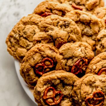 full white plate of chocolate chip pretzel cookies