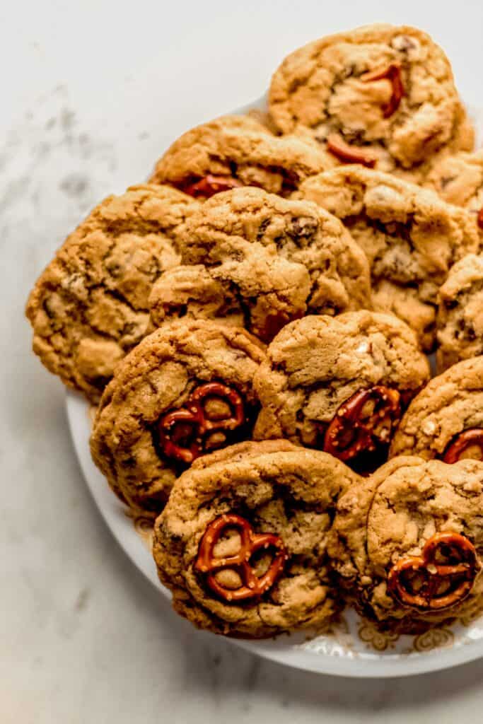 full white plate of chocolate chip pretzel cookies 