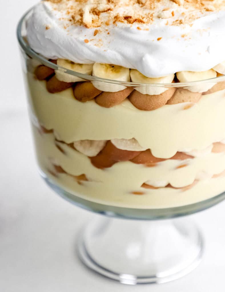 Close up view of banana pudding in trifle dish.