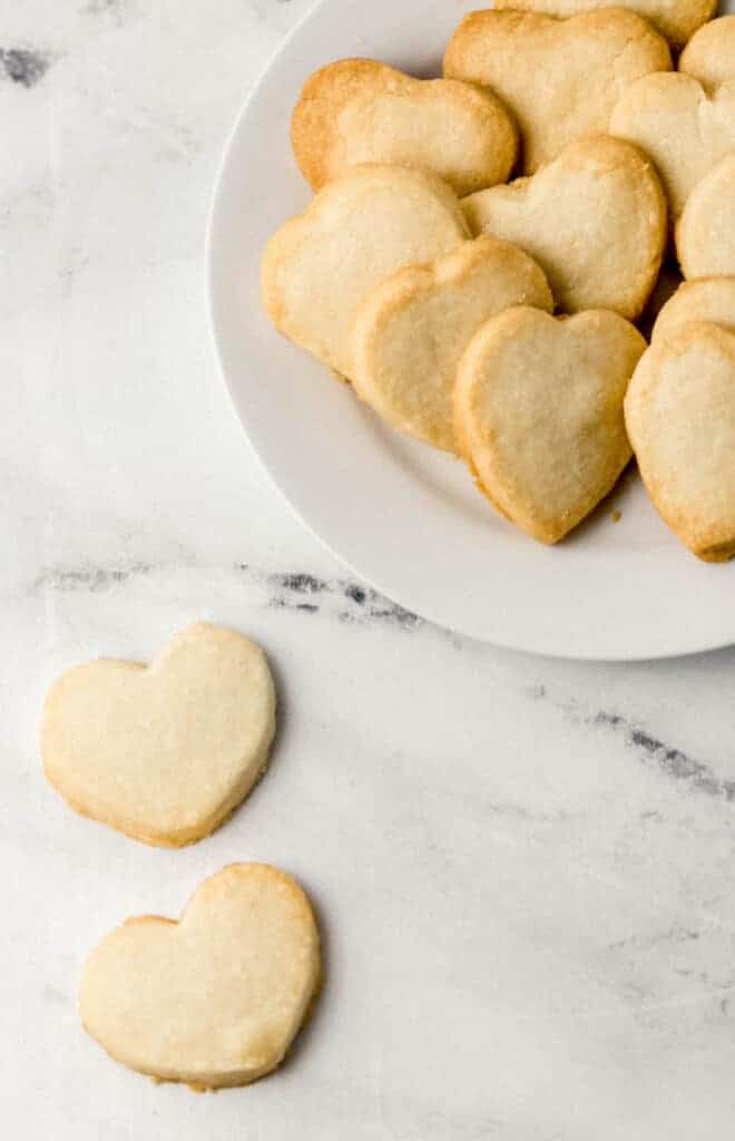 finished cookies on marble surface and white plate