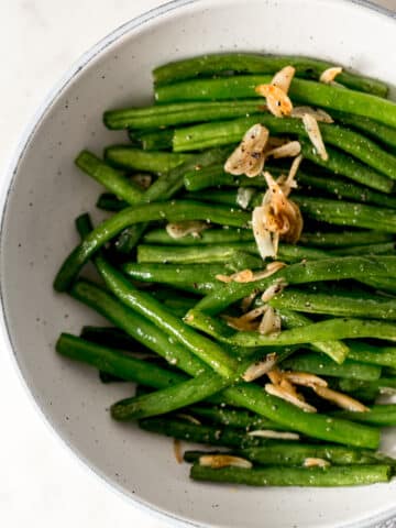 garlic green beans in a bowl with a napkin