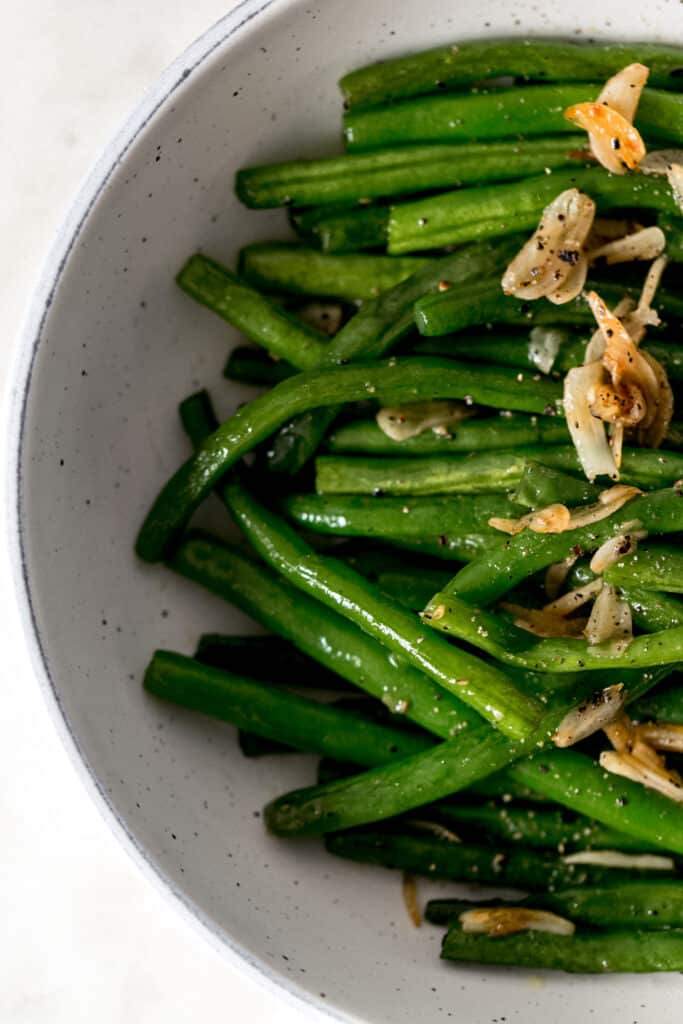 overhead view garlic green beans in a bowl