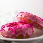 Close up of donuts on a plate.