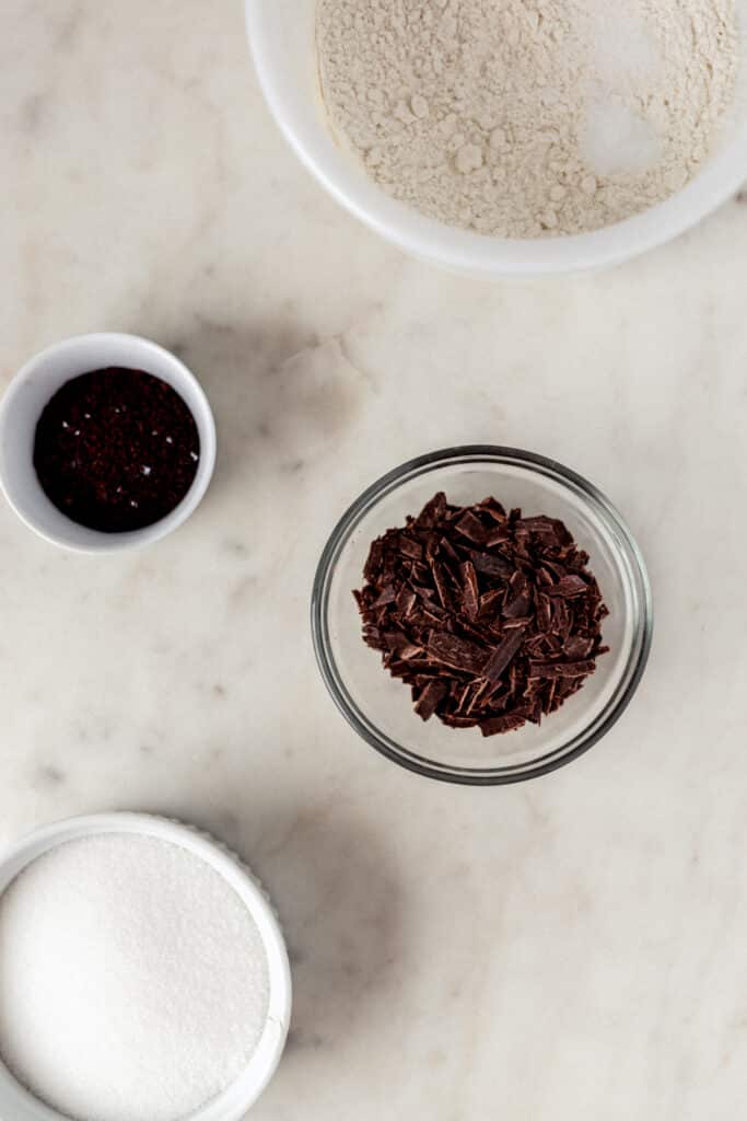 mixing bowl with flour, salt, baking soda, and a spoon