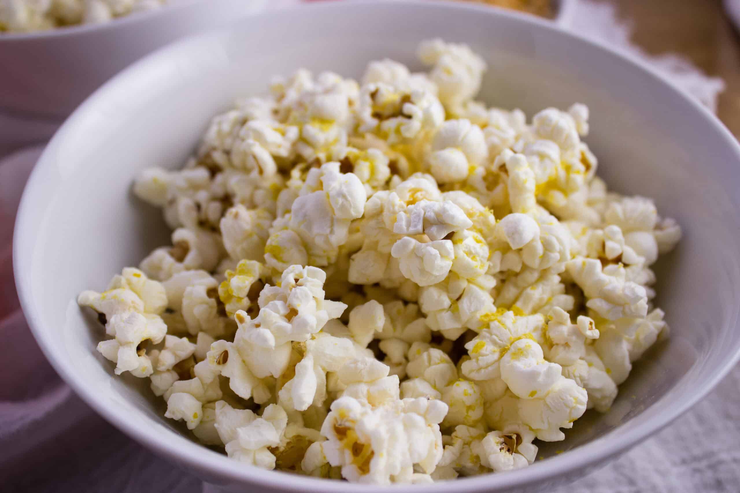 Close up side view of bowl of popcorn. 