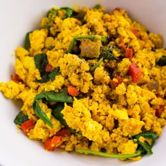 Tofu Scramble Recipe - Quick and Easy egg substitute for vegans that can be enjoyed as is or rolled into a flour tortilla for a delicious breakfast burrito. simplylakita.com #vegan #tofu