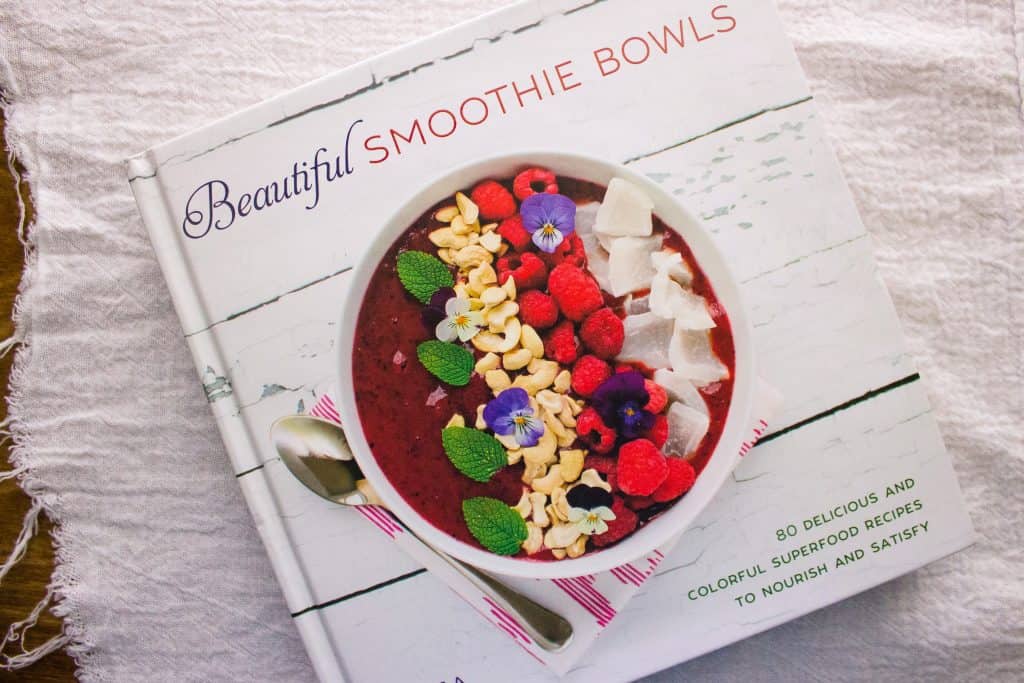 overhead view of cookbook the Bright Berry Acai Smoothie Bowl was in 
