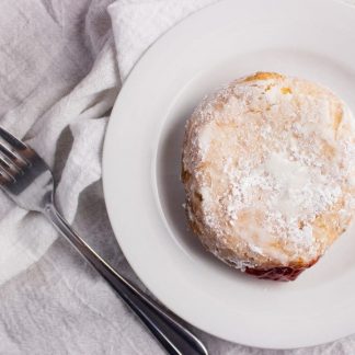 Strawberry Preserve Donuts - Deep fried cake donuts filled with strawberry preserves make the perfect treat to enjoy in bed on Mother's Day with fresh fruit and your favorite cup of coffee. simplylakita.com #donuts #strawberry