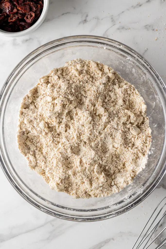butter and flour mixture for scones in glass mixing bowl 
