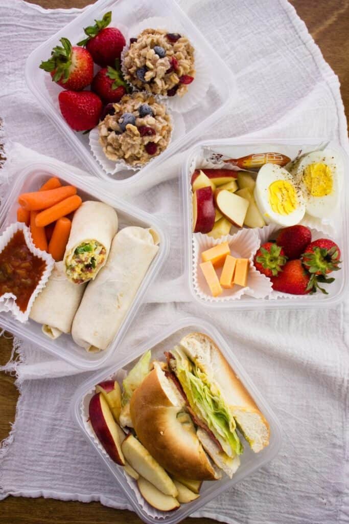overhead view of four container with breakfast in them