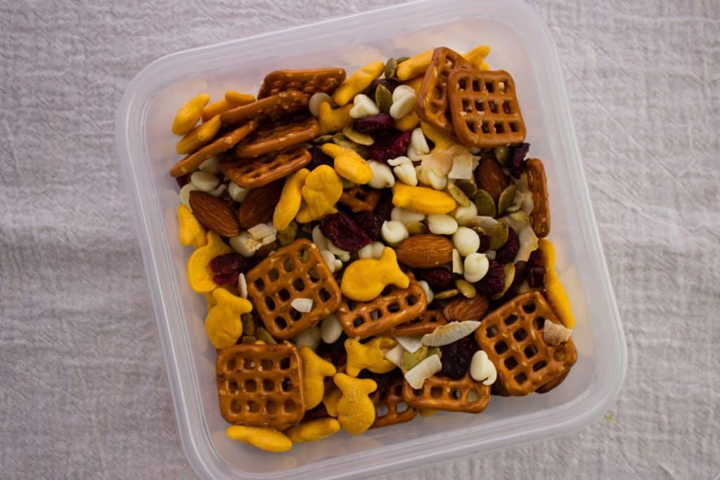 snack mix in plastic storage container