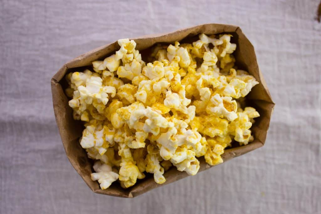 popcorn in brown paper bag