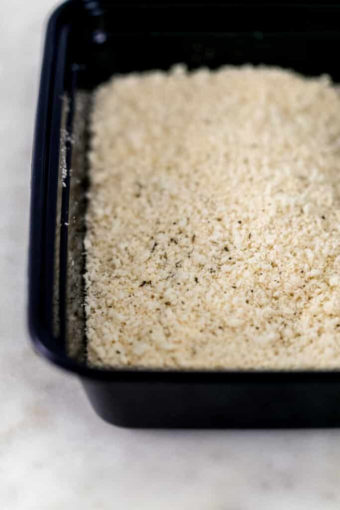 breadcrumb mixture in black plastic container