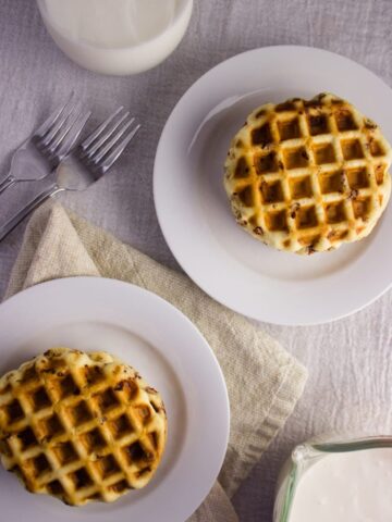 Cinnamon Roll Waffles - Get the delicious taste of cinnamon rolls in the form of a waffle topped with a cream cheese icing. So easy and delicious! simplylakita.com #breakfast #cinnamonroll #waffles