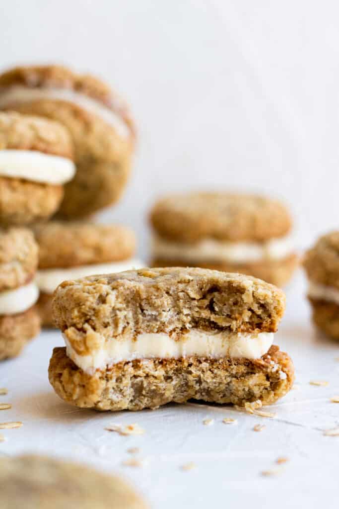 close up side view oatmeal cream pie with a pie into it. 