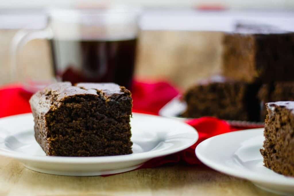 side view Ginger Cake Square on white plate 