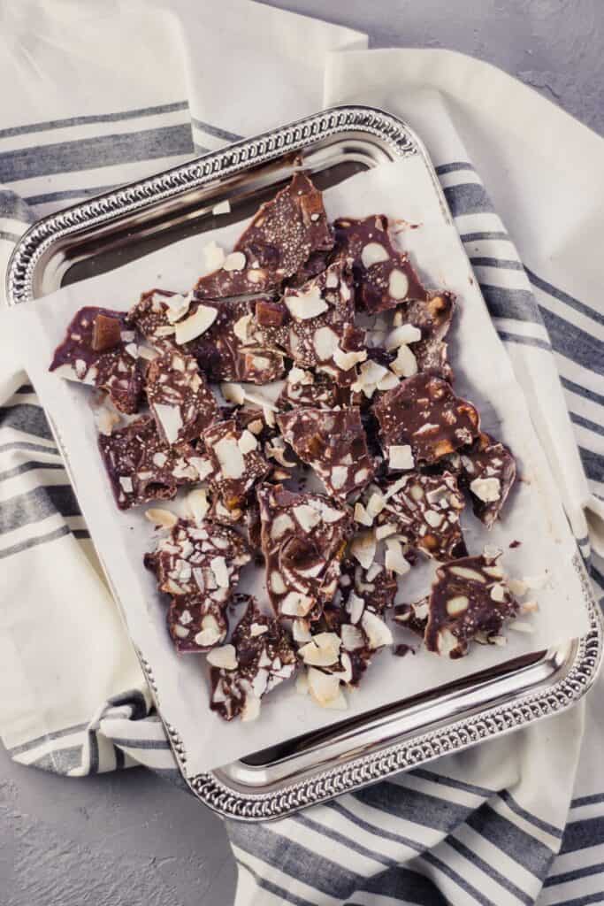 Finished Trail Mix Bark on silver platter over a napkin