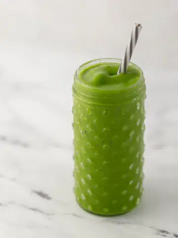 glass with smoothie and straw