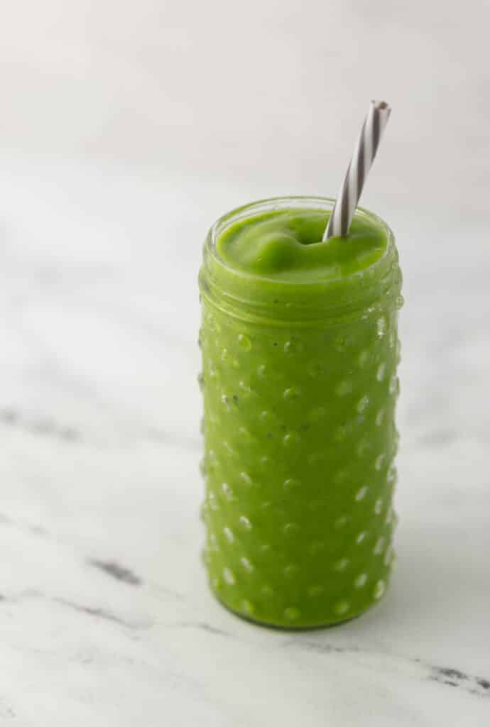 glass with smoothie and straw