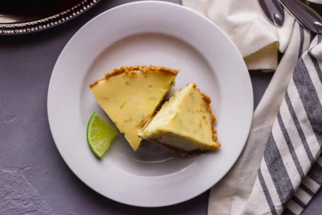 2 slices of key lime pie for 2 on a white plate