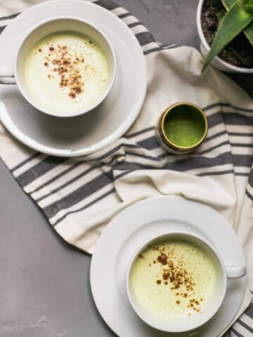 overhead view of matcha latte in two cups