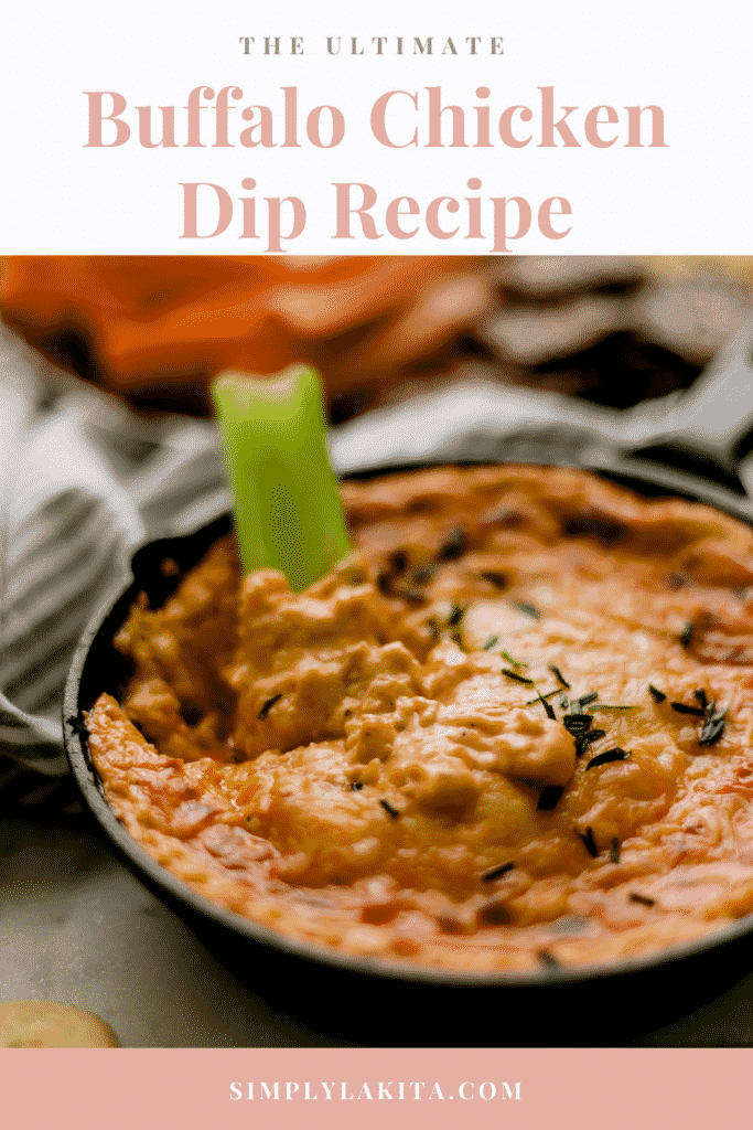 buffalo chicken dip recipe in a cast iron skillet with a celery in it