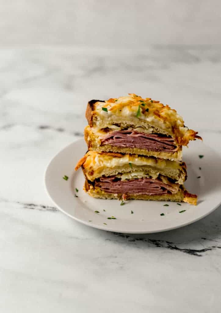 sandwich cut in half on white plate