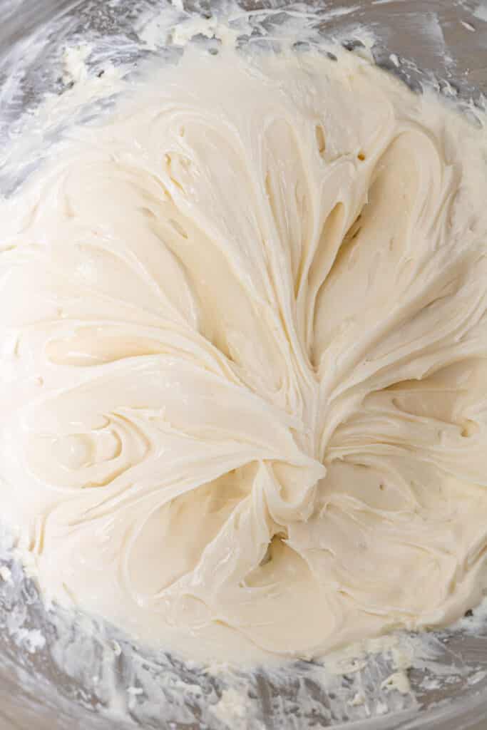 cream cheese, powder sugar and vanilla combined together in stand mixer bowl. 