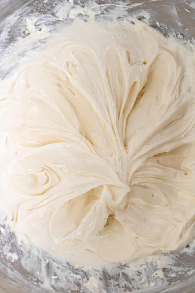 cream cheese, powder sugar and vanilla combined together in stand mixer bowl.