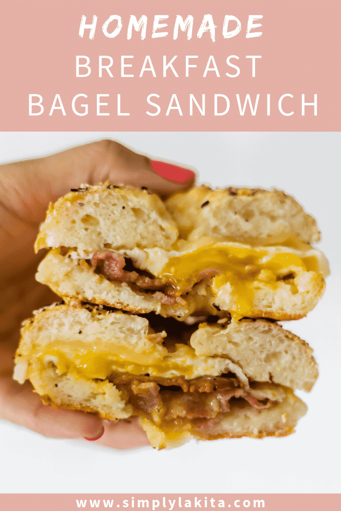 hand holding breakfast bagel sanwich