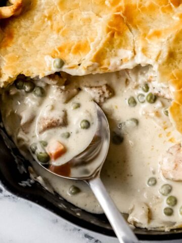 close up view of chicken pie with spoon in it
