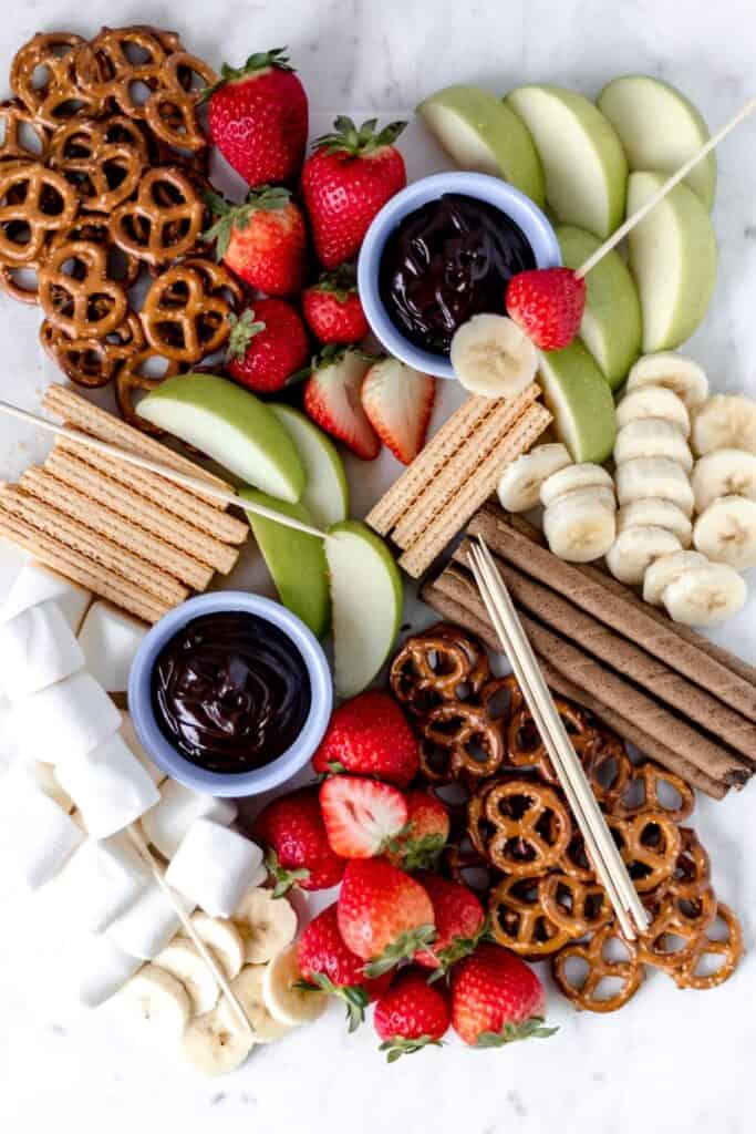 overhead view epic dessert board with chocolate dipping sauce