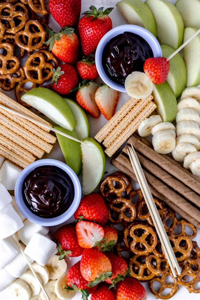 overhead view epic dessert board with sweets and fruit