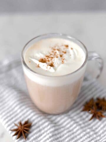 close up view chai latte on napkin with star anise