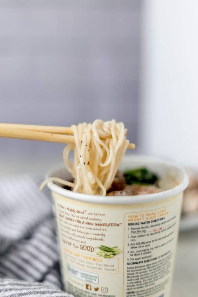 close-up side view instant ramen with chopsticks