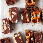 Close up overhead view of cut up fudge on parchment paper.