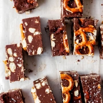 Close up overhead view of cut up fudge on parchment paper.