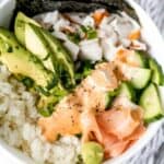 California Roll Bowl in white bowl on top of cloth napkin