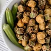 Close up of fresh and fried okra in a white bowl.