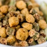 Close up side view of fried okra in a bowl.