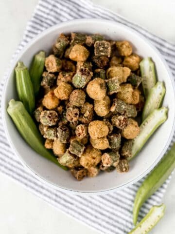 overhead view fried okra in a large white bowl