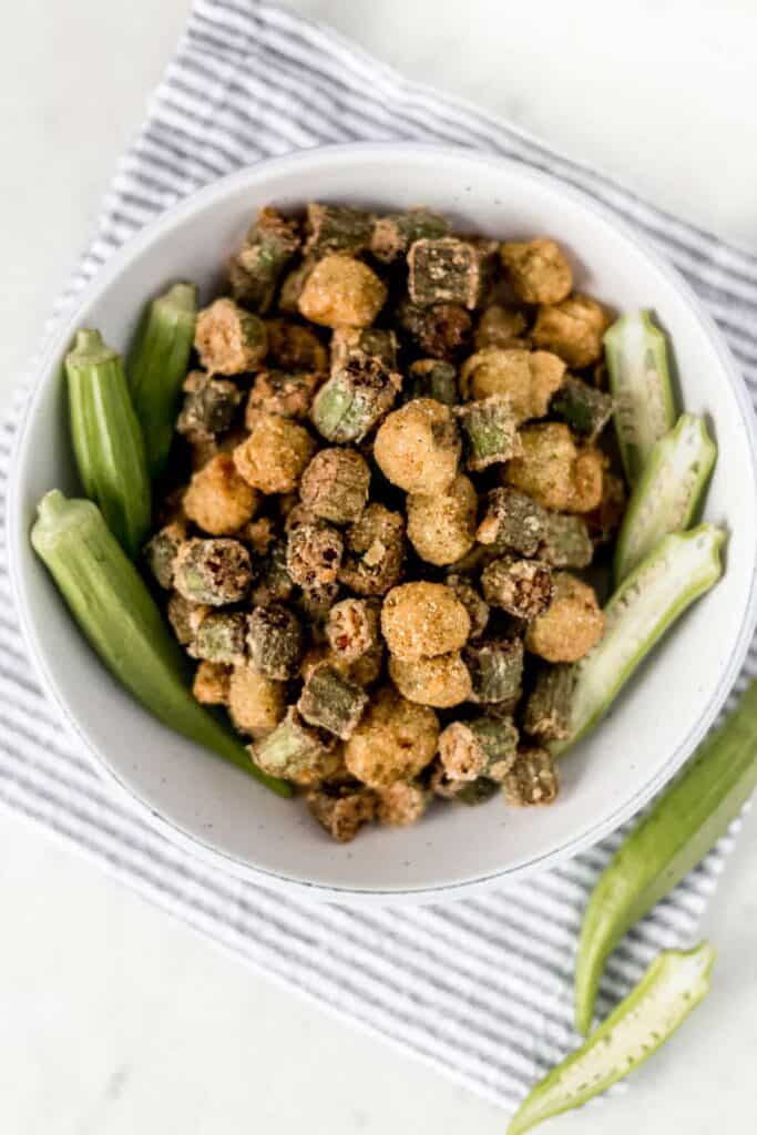 overhead view fried okra in a large white bowl 