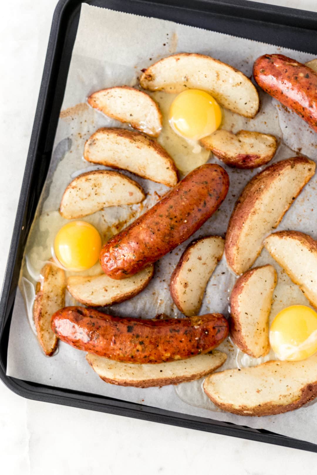 cracked eggs on sheet pan breakfast bake